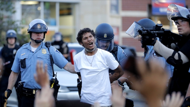 A protester is arrested