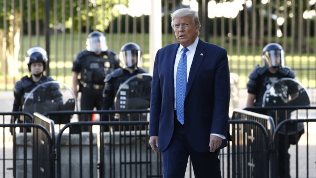 Trump in front of riot police