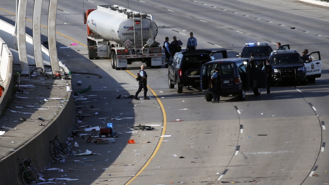 Police in the area where a tanker truck rushed to a stop among protesters on an interstate