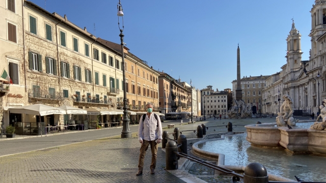 Journalist and American expatriate John Henderson on the empty streets of Rome in April.