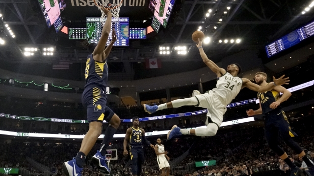 Giannis Antetokounmpo shoots after being fouled during the second half of an NBA basketball game.