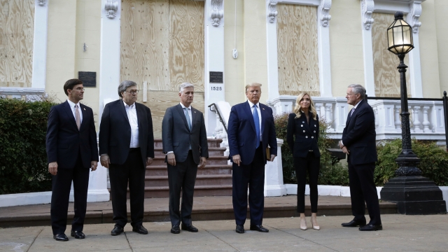 President Donald Trump stands outside St. John's Church across Lafayette Park from the White House in Washington