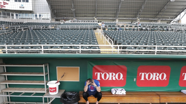 Baseball player in empty stadium