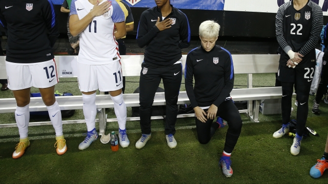Soccer star Megan Rapinoe kneeling during a 2016 game