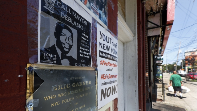 A make-shift memorial to Eric Garner on a building wall in New York, where he died