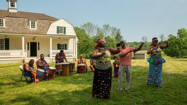 Performers demonstrate traditional African song and dance