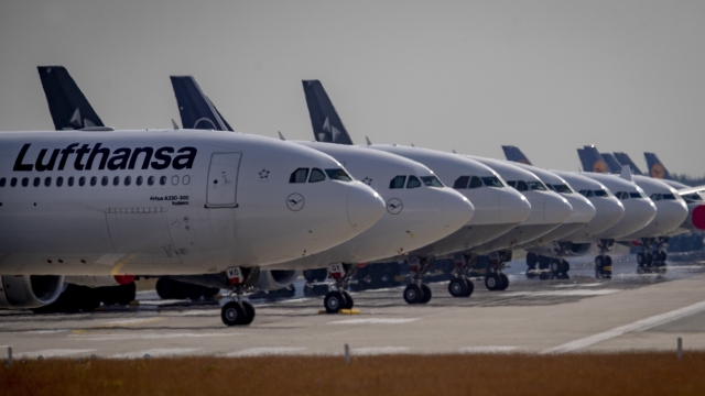 Lufthansa planes sit grounded at an airport
