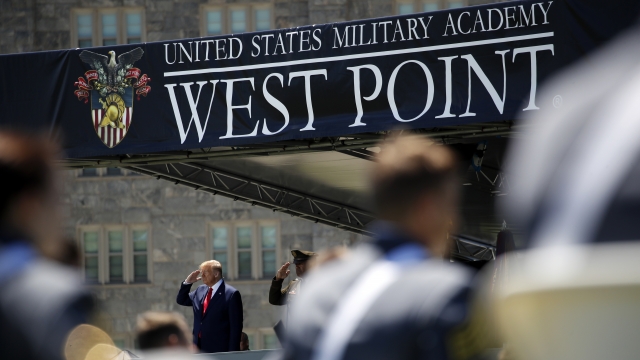 President Donald Trump, left, and United States Military Academy Lt. Gen. Darryl Williams, right, salute