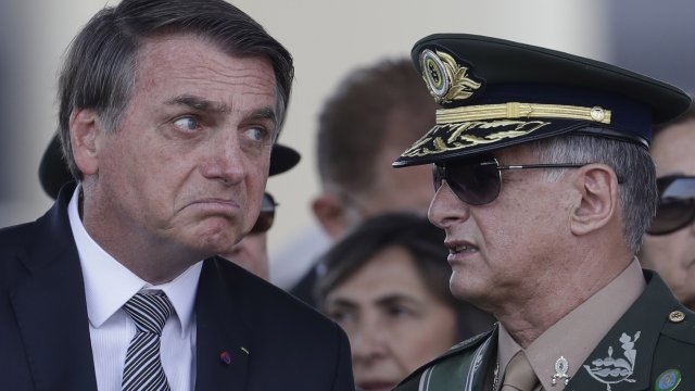 Brazil's President Jair Bolsonaro talks with Army Commander General Edson Leal Pujol