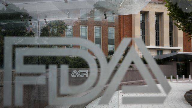 The FDA building is visible behind FDA logos.