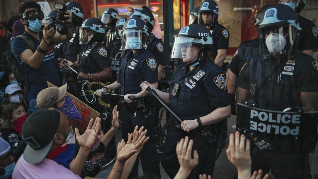 New York City Police facing off with activists during a protest march in Brooklyn.