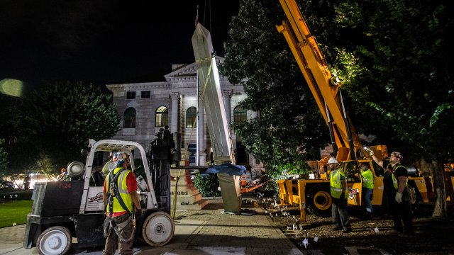 Workers remove a Confederate monument with a crane in Decatur, Georgia.