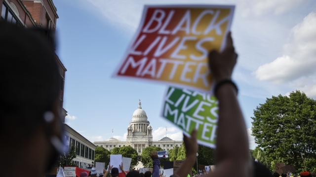 A protester holds a Black Lives Matter sign