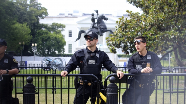 U.S. Secret Service police watch as demonstrators protest the death of George Floyd