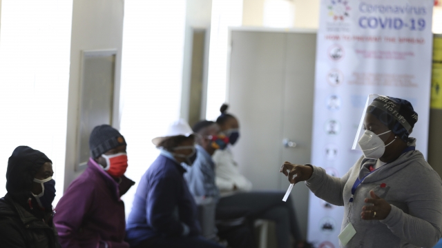 Medical worker prepares volunteers for COVID-19 vaccine trail at Chris Hani Baragwanath Hospital in South Africa.