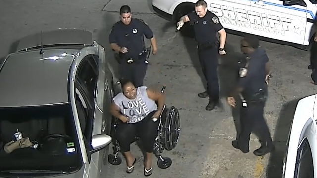 Deputies from Harris County Sheriff's Office fire taser at African American woman seated in wheelchair