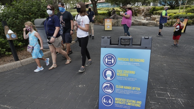 Signs remind guests of new safety measures in place at SeaWorld as it reopened.