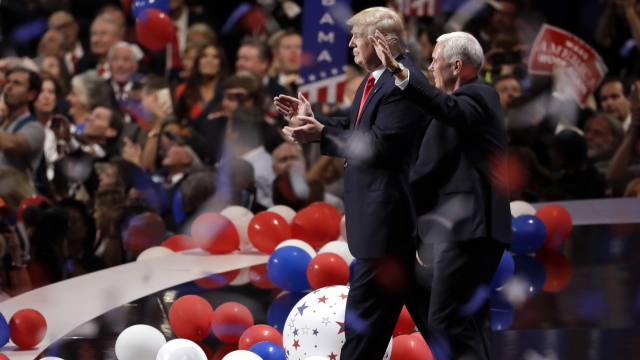 President Donald Trump walks with Vice President Mike Pence at the 2016 RNC.