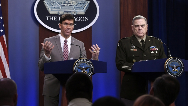 U.S. Defense Secretary Mark Esper, left, speaks during a briefing with the Chairman of the Joint Chiefs of Staff Army Gen. Ma