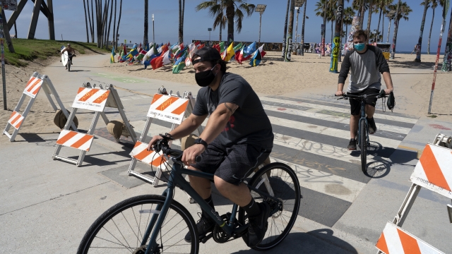 Masked cyclists at Venice Beach