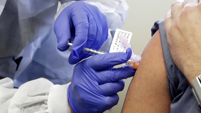 Person receives dose of vaccine