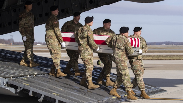 In Dec. 25 photo, U.S. Army team moves coffin of Special Forces soldier who died in Afghanistan.