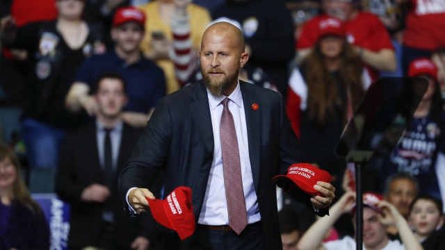 Brad Parscale, manager of President Donald Trump's reelection campaign, holds "Make America Great Again," hats.