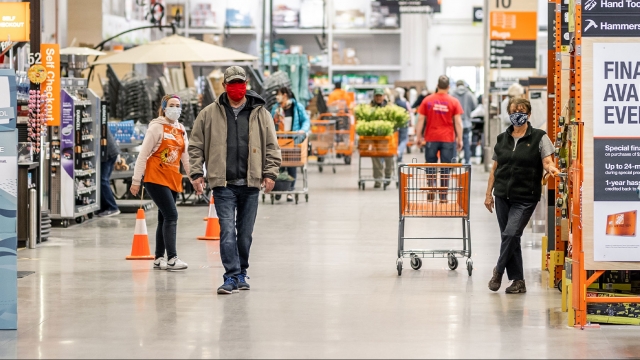 Home Depot employees and shoppers wear masks