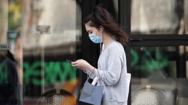 A woman wearing protective face mask in Paris