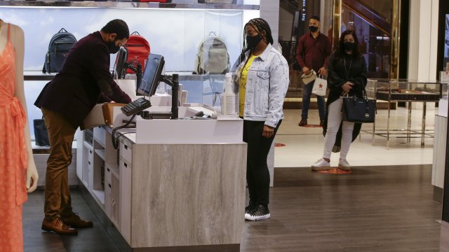 Employees and shoppers at Macy's in New York