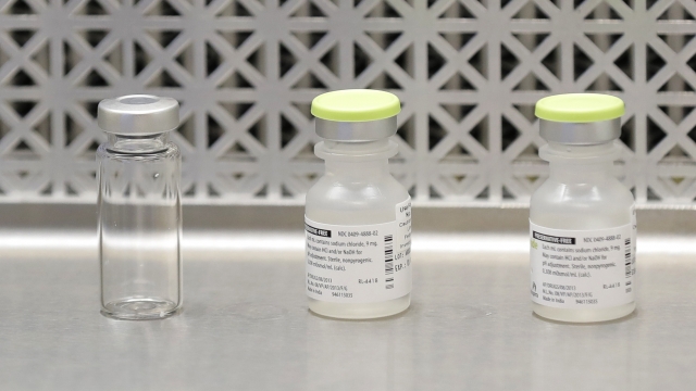 Vials used by pharmacists to prepare syringes used in a first-stage clinical trial of a COVID-19 vaccine