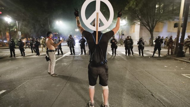 Protester holding peace symbol