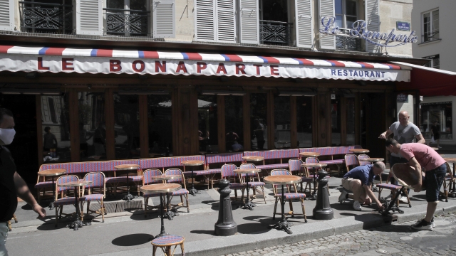 Parisian waiters move tables apart