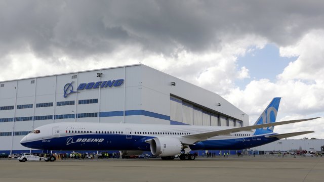 In this 2017 file photo, Boeing employees stand near the new Boeing 787-10 at the company's facility in North Charleston, SC.