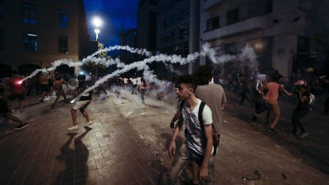 Teargas canisters fly during anti-government protest following Tuesday's massive explosion which devastated Beirut, Lebanon