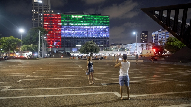 Tel Aviv City Hall is lit up with the flags of the United Arab Emirates and Israel as the two announced diplomatic ties.