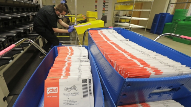 Vote-by-ballots are sorted into trays