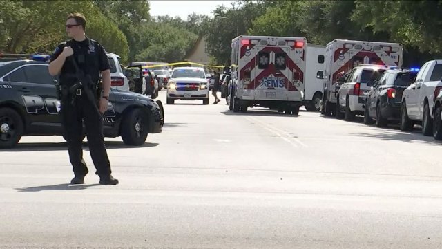 Police officer guards scene of barricade near Austin, Texas