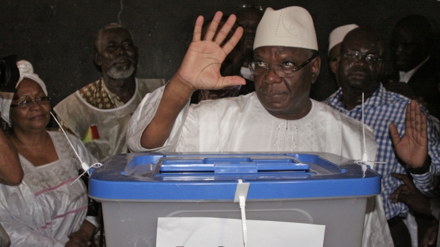 Mali presidential candidate Ibrahim Boubacar Keita gestures after casting his ballot in Bamako, Mali, Sunday, 28, July, 2013