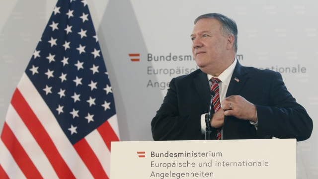Secretary of State Mike Pompeo stands in front of American flag during Austrian visit