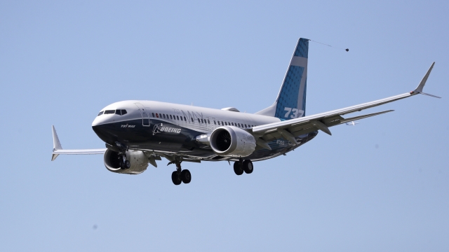 A Boeing 737 MAX jet heads to a landing at Boeing Field following a test flight in June.