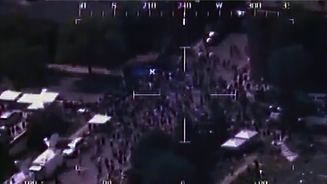 The photo shows a scene captured by a RC-26 aircraft flying over a Minneapolis protest.