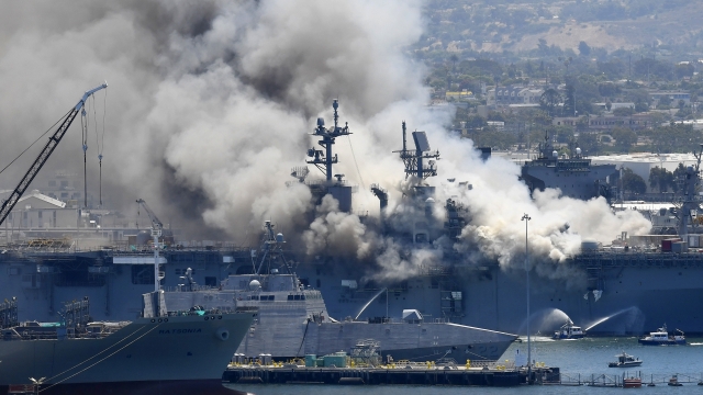 Smoke rises from the USS Bonhomme Richard at Naval Base San Diego in San Diego, after an explosion and fire on board the ship