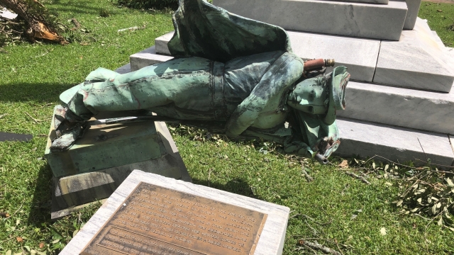 A statue of a Confederate soldier in front of a courthouse in Lake Charles, La., lies on the ground.