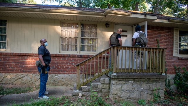 U.S. Marshals authorities at a home