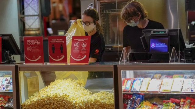 Concessions workers stock bins AMC Theatres open for some of the first showings since the pandemic started.