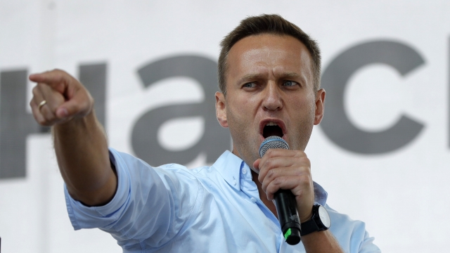 Russian opposition activist Alexei Navalny gestures while speaking to a crowd during a political protest in Moscow, Russia.