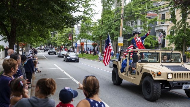 A July 4th parade in Rhode Island. Newsy analysis found new COVID-19 cases surged nationally the weeks following the 4th.