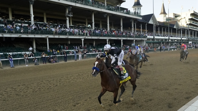 Jockey John Velazquez riding Authentic, wins the 146th running of the Kentucky Derby at Churchill Downs, Saturday, Sept. 5