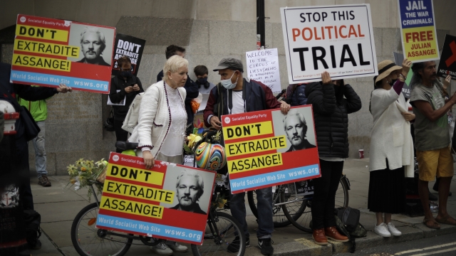 Supporters of WikiLeaks founder Julian Assange take part in a protest outside the Central Criminal Court